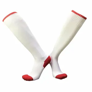 White knee-high football socks with red toe and heel accents in an X-shaped display