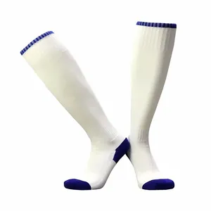 Detail of white soccer socks featuring blue toe and cushioned towel sole for sports.