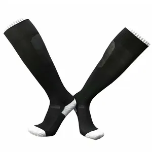 Detailed view of high-performance black and grey long soccer socks with towel bottom