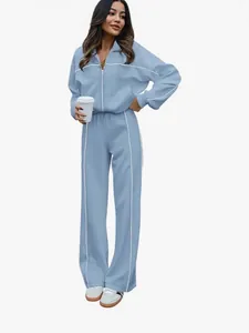 Survêtement deux pièces bleu pour femme avec sweat à fermeture éclair et pantalon large