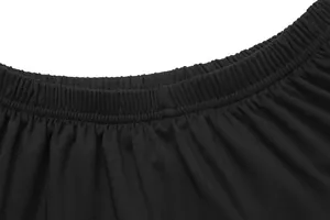 Detailed macro shot of the black elastic waistband on a children's pleated tennis skirt
