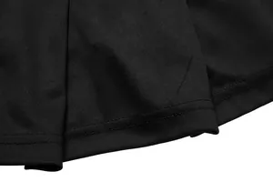 Close-up detail of black pleated tennis skirt fabric and stitching seams