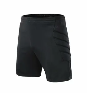 Short de gardien de but de football noir avec rembourrage latéral de protection.