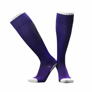 Detail view of purple soccer socks with grey heel and reinforced cushioned sole