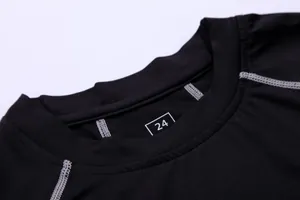 Close-up detail of the neckline on a black quick-drying compression sports shirt