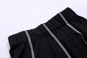 Detail of the elastic waistband on high-performance black quick-dry compression leggings