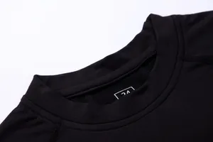 Detail view of the reinforced crew neck on a black thermal compression training shirt