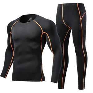 Men's black quick-dry compression top and leggings set with orange contrast stitching