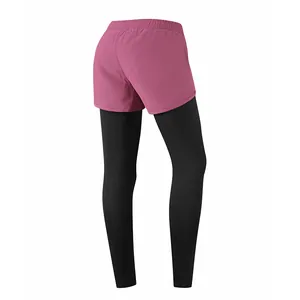 Rear view of women's 2-in-1 quick-drying sports leggings featuring pink shorts layer