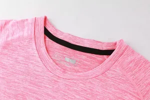 Detailed macro view of the round neckline on a pink heathered quick-dry sports T-shirt