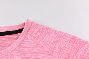 Close-up of pink heather sports T-shirt neckline with durable raglan sleeve seams