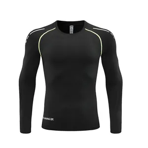 Maglia a compressione nera a maniche lunghe ad asciugatura rapida con dettagli giallo fluo