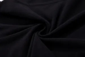 Macro detail of black fleece-lined quick-dry fabric for sports compression wear