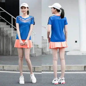 Front and back view of a blue quick-dry sports t-shirt and orange pleated tennis skirt.