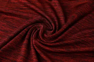 Close-up macro detail of breathable quick-dry heathered sports fabric in maroon and black