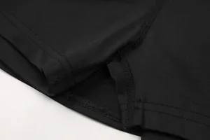 Close-up of durable flatlock stitching on black tennis skort inner safety shorts fabric