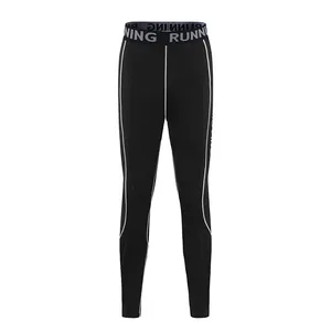 Detail of kids quick-dry sports compression pants with RUNNING elastic waistband
