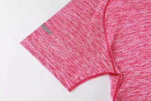Close-up of pink heathered athletic t-shirt sleeve with reflective strip detail