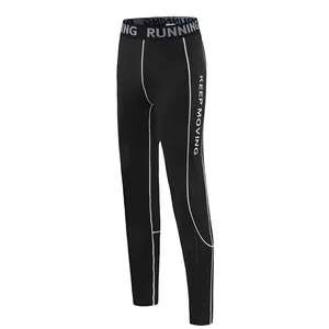 Close-up of black quick-dry compression leggings with Keep Moving print and white stitching.