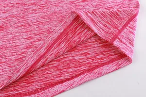 Close-up macro detail of red space-dye quick-dry sports fabric with flatlock stitching