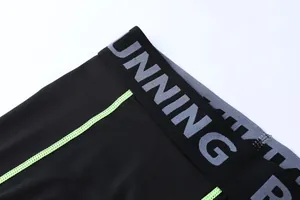 Close-up view of the elastic waistband on quick-dry black compression sports leggings for kids