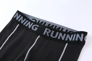 Detailed macro view of kids high waist compression leggings featuring RUNNING elastic waistband