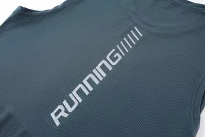 Close-up macro detail of breathable quick-dry sports tank top with silver RUNNING print text