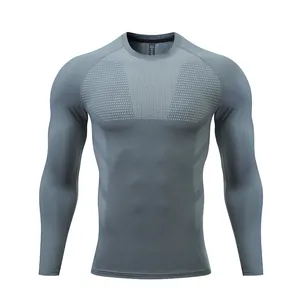 Front view of grey long-sleeve compression gym shirt with breathable chest texture
