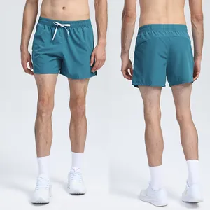 Professional front and back view of teal quick-dry athletic shorts for running and gym training