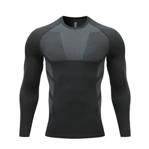 Detail of black men's long-sleeve compression shirt with breathable grey mesh patterns