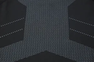Macro detail of quick-dry compression fabric with grey textured pattern for men