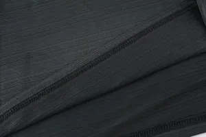 Macro view of high-quality stitching and breathable texture on black sports T-shirt