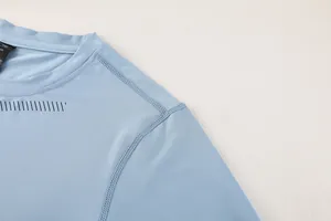 Close-up of men's quick-dry fitness shirt featuring reinforced seams and laser cut vents.
