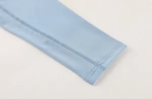 Detail view of double-stitched cuff on light blue men's fast-dry compression shirt