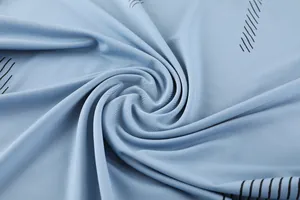Macro view of blue quick-dry stretch fabric texture with black linear pattern.