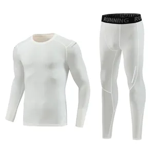 Set of white men's compression sports gear featuring long-sleeved top and leggings