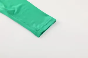 Macro detail of flatlock stitching on green quick-dry long sleeve sports shirt cuff