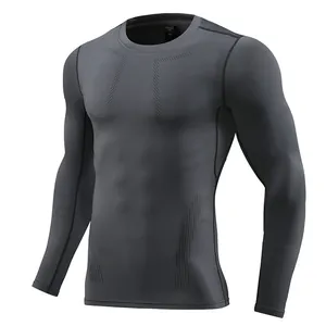 Detailed view of a dark grey long-sleeve compression shirt with textured patterns