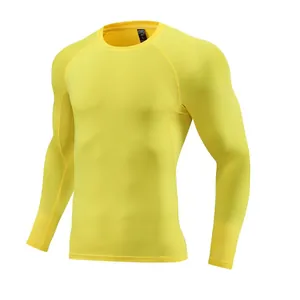 Bright yellow long-sleeved compression shirt for athletic fitness and training