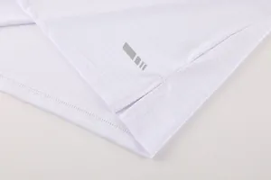 Close-up detail of white breathable quick-dry sports fabric with side slit hem construction