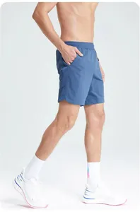 Detailed side view of men's blue athletic shorts with breathable mesh panel design
