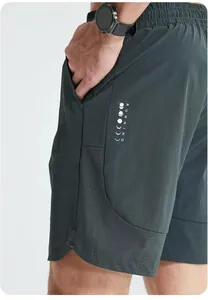 Side view detail of men's quick-dry sports shorts showing vertical running print and texture