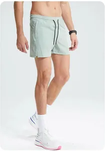 Detail view of men's athletic shorts featuring side pockets and adjustable drawstring