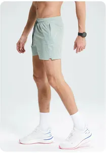 Side view detail of men's quick-dry running shorts showing athletic fit and cut