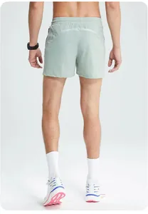 Back view of breathable men's quick-dry mint green running shorts for outdoor fitness