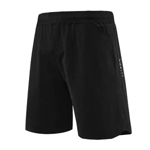 Detail of black men's quick-dry athletic shorts for fitness and running sessions.