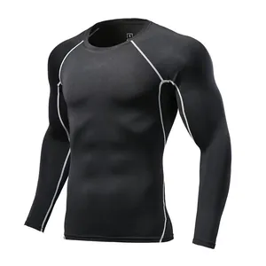 Detail of black long sleeve compression shirt with white contrast stitching
