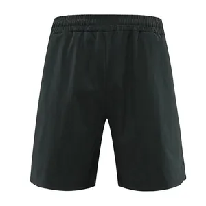 Detailed back view of men's black quick-dry athletic shorts for running and gym training