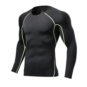 Close-up detail view of black athletic compression shirt with neon green contrast stitching