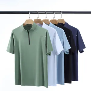 Detailed view of quick-dry half-zip sports T-shirts in multiple colors on hangers
